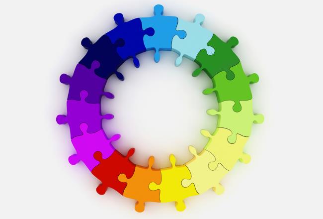 Bunte Puzzleteile, die mehrere Kreise bilden.