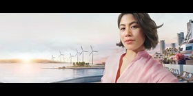 Woman infront of wind turbines